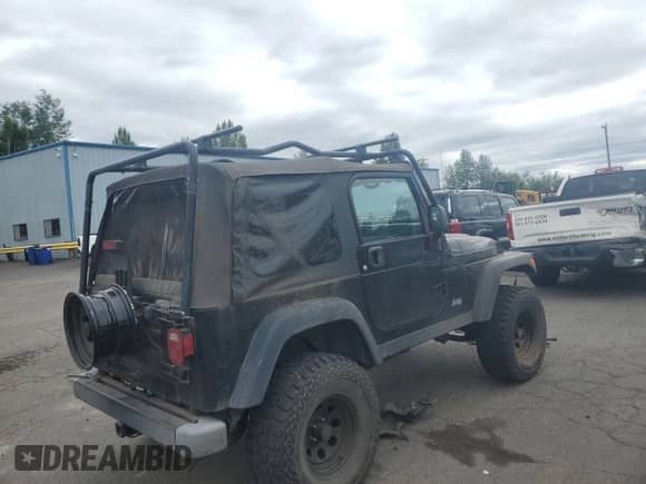 2003 Jeep Wrangler Rubicon с VIN 1J4FA69S93P334595, выставлен на аукционе Copart как лот 68247145 с пробегом 127 361 миль миль и Списание • Salvage title. История ставок и продаж доступна на DreamBid. Изображение 3.