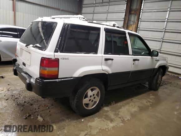 1995 Jeep Grand Cherokee Laredo with VIN 1J4GZ58S6SC630947, listed as a Copart auction lot 82143564 with 267,946 mi miles and Salvage title. Bid and sale history available at DreamBid. Image 3.