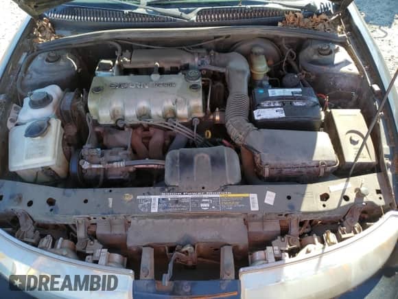 1997 Saturn SC with VIN 1G8ZF1286VZ266912, listed as a Copart auction lot 46953875 with 149,017 mi miles and Salvage title. Bid and sale history available at DreamBid. Image 11.