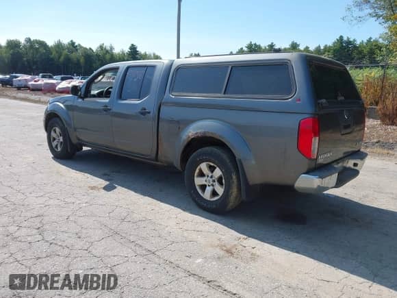 2009 Nissan Frontier SE with VIN 1N6AD09WX9C401340, listed as a IAAI auction lot 43170418 with 212,858 mi miles and . Bid and sale history available at DreamBid. Image 3.