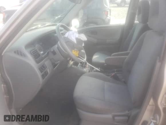 2003 Chevrolet Tracker with VIN 2CNBJ13C936947062, listed as a Copart auction lot 59820603 with 65,344 mi miles and Salvage title. Bid and sale history available at DreamBid. Image 7.