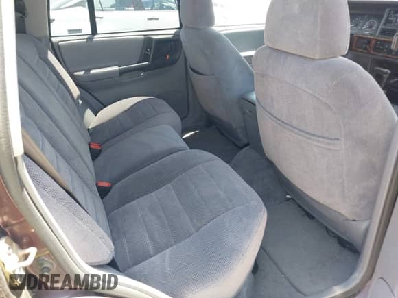 1996 Jeep Grand Cherokee Laredo z VIN 1J4GZ58Y2TC354076, wystawiony jako IAAI lot #42572842 z przebiegiem 172 282 mil mil oraz . Historia ofert i sprzedaży dostępna na DreamBid. Obrazek 8.