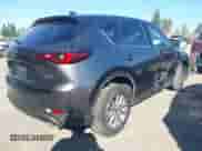 2023 Mazda CX-5 S Carbon Edition z VIN JM3KFBCM6P0143148, wystawiony jako IAAI lot #43382486 z przebiegiem 22 099 mil mil oraz . Historia ofert i sprzedaży dostępna na DreamBid. Obrazek 4.