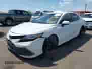 2022 Toyota Camry Hybrid LE with VIN 4T1C31AK8NU594181, listed as a IAAI auction lot 42666278 with 35,921 mi miles and . Bid and sale history available at DreamBid. Image 2.