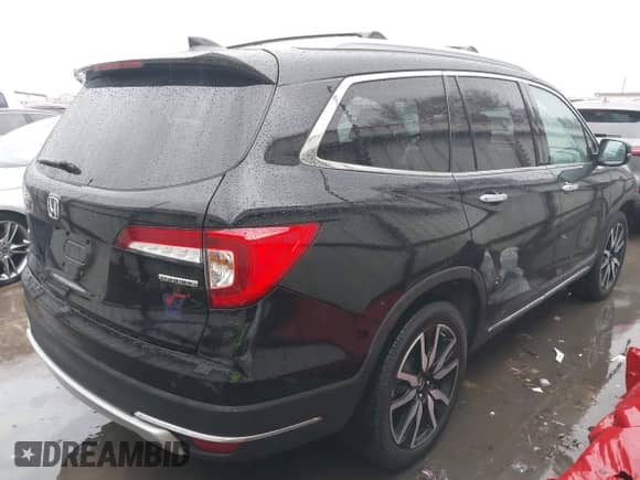 2020 Honda Pilot Touring 7-Passenger z VIN 5FNYF5H64LB000287, wystawiony jako IAAI lot #41288778 z przebiegiem 58 568 mil mil oraz . Historia ofert i sprzedaży dostępna na DreamBid. Obrazek 4.