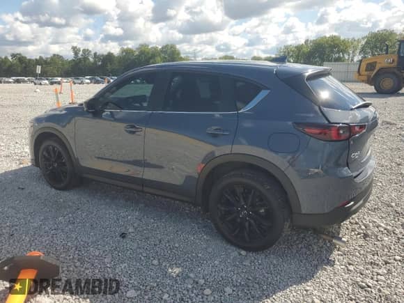 2023 Mazda CX-5 S Carbon Edition z VIN JM3KFBCM7P0169757, wystawiony jako Copart lot #70624645 z przebiegiem 31 275 mil mil oraz Szkoda całkowita • Salvage title. Historia ofert i sprzedaży dostępna na DreamBid. Obrazek 2.