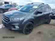 2018 Ford Escape SE z VIN 1FMCU9GD7JUC34463, wystawiony jako IAAI lot #43081579 z przebiegiem 85 940 mil mil oraz . Historia ofert i sprzedaży dostępna na DreamBid. Obrazek 2.