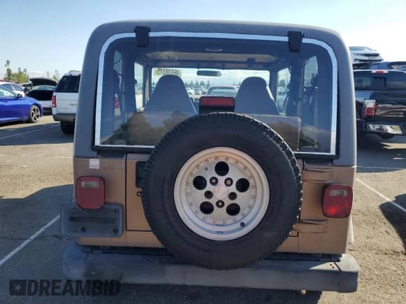 1999 Jeep Wrangler Sport with VIN 1J4FY19S9XP417531, listed as a Copart auction lot 86538315 with 161,004 mi miles and Salvage title. Bid and sale history available at DreamBid. Image 6.