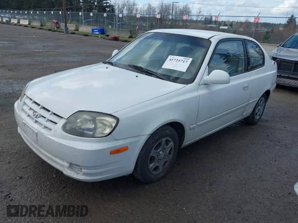 2004 Hyundai Accent GL z VIN KMHCG35C74U303431, wystawiony jako IAAI lot #41725717 z przebiegiem 211 893 mil mil oraz . Historia ofert i sprzedaży dostępna na DreamBid. Obrazek 2.