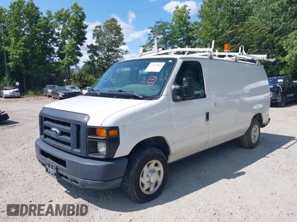 2014 Ford Econoline Cargo Commercial with VIN 1FTNE1EW8EDA98589, listed as a IAAI auction lot 42529081 with 186,595 mi miles and . Bid and sale history available at DreamBid. Image 2.