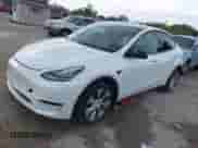 2022 Tesla Model Y Long Range z VIN 7SAYGDEE8NF441090, wystawiony jako IAAI lot #43139344 z przebiegiem 37 850 mil mil oraz . Historia ofert i sprzedaży dostępna na DreamBid. Obrazek 2.