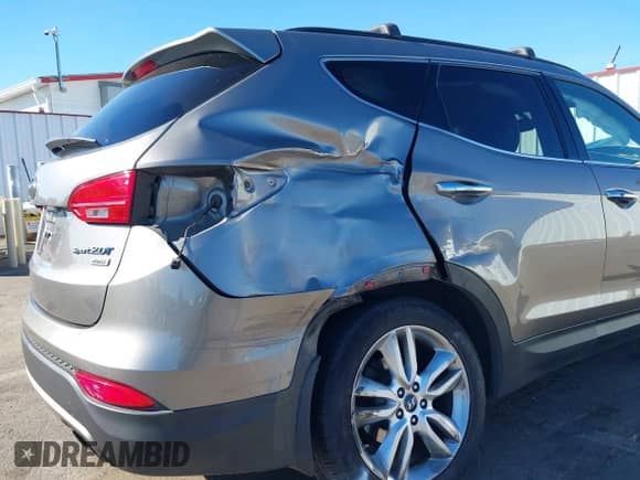 2013 Hyundai Santa Fe Sport z VIN 5XYZUDLA3DG077162, wystawiony jako IAAI lot #43326274 z przebiegiem Nie podano mil oraz . Historia ofert i sprzedaży dostępna na DreamBid. Obrazek 17.