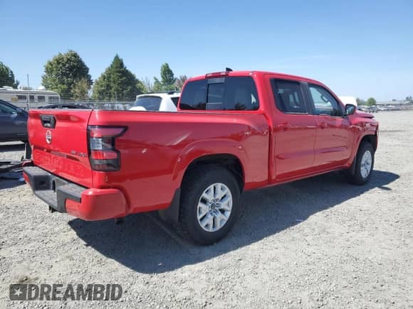 2023 Nissan Frontier SV with VIN 1N6ED1FK8PN612661, listed as a Copart auction lot 69260674 with 23,478 mi miles and Salvage title. Bid and sale history available at DreamBid. Image 3.