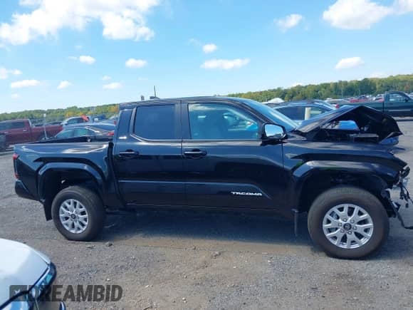 2024 Toyota Tacoma SR5 with VIN 3TMLB5JN7RM077957, listed as a IAAI auction lot 43149381 with 11,806 mi miles and . Bid and sale history available at DreamBid. Image 13.