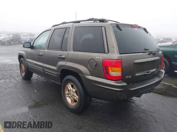 1999 Jeep Grand Cherokee Limited with VIN 1J4GW68N2XC597168, listed as a IAAI auction lot 43562462 with 145,584 mi miles and . Bid and sale history available at DreamBid. Image 3.