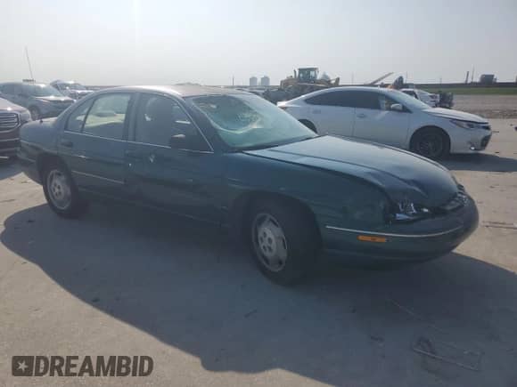 1998 Chevrolet Lumina with VIN 2G1WL52M7W9310815, listed as a Copart auction lot 59181775 with 93,661 mi miles and Salvage title. Bid and sale history available at DreamBid. Image 4.