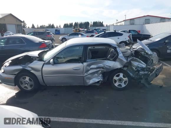 2005 Chevrolet Malibu Classic z VIN 1G1ND52F55M194185, wystawiony jako IAAI lot #41534541 z przebiegiem Nie podano mil oraz . Historia ofert i sprzedaży dostępna na DreamBid. Obrazek 15.