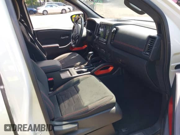 2023 Nissan Frontier Pro-4X with VIN 1N6ED1EK3PN614884, listed as a IAAI auction lot 42571950 with 13,307 mi miles and . Bid and sale history available at DreamBid. Image 5.