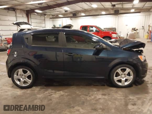2015 Chevrolet Sonic LS with VIN 1G1JA6SH4F4160285, listed as a IAAI auction lot 42436278 with 94,122 mi miles and . Bid and sale history available at DreamBid. Image 14.