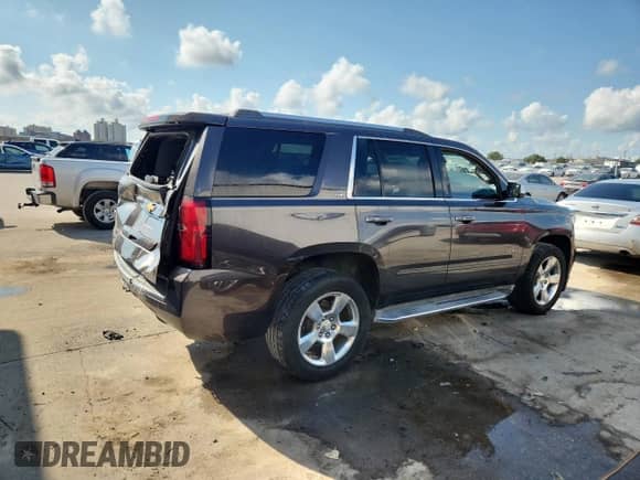 2015 Chevrolet Tahoe LTZ с VIN 1GNSCCKC2FR279732, выставлен на аукционе Copart как лот 71015645 с пробегом 106 511 миль миль и Списание • Salvage title. История ставок и продаж доступна на DreamBid. Изображение 3.
