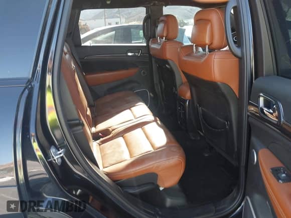 2016 Jeep Grand Cherokee SRT with VIN 1C4RJFDJ3GC404557, listed as a IAAI auction lot 43124966 with 112,863 mi miles and . Bid and sale history available at DreamBid. Image 8.