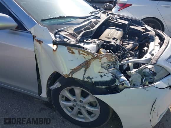 2007 Toyota Camry LE z VIN 4T1BE46K07U165703, wystawiony jako IAAI lot #43561723 z przebiegiem 131 470 mil mil oraz . Historia ofert i sprzedaży dostępna na DreamBid. Obrazek 12.