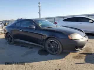2006 Hyundai Tiburon GT с VIN KMHHN65F46U217049, выставлен на аукционе Copart как лот 87972565 с пробегом 88 945 миль миль и Чистый • Clean title. История ставок и продаж доступна на DreamBid. Изображение 4.
