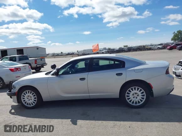 2020 Dodge Charger Police z VIN 2C3CDXKTXLH124217, wystawiony jako IAAI lot #43154620 z przebiegiem 119 464 mil mil oraz . Historia ofert i sprzedaży dostępna na DreamBid. Obrazek 14.