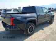 2024 Toyota Tacoma TRD Off Road with VIN 3TMLB5JN7RM069938, listed as a IAAI auction lot 43056789 with 6,837 mi miles and . Bid and sale history available at DreamBid. Image 4.
