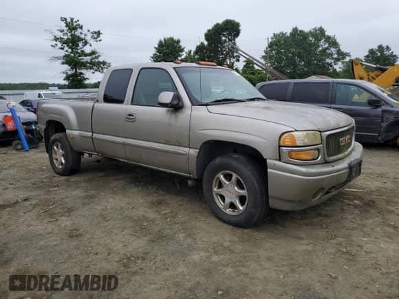 2002 GMC Sierra 1500 Denali z VIN 2GTFK69U321309689, wystawiony jako Copart lot #60267695 z przebiegiem 351 508 mil mil oraz Czysty tytuł • Clean title. Historia ofert i sprzedaży dostępna na DreamBid. Obrazek 4.