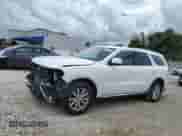 2015 Dodge Durango SXT with VIN 1C4RDHAG1FC244429, listed as a Copart auction lot 68557175 with 102,623 mi miles and Salvage title. Bid and sale history available at DreamBid. Image 1.