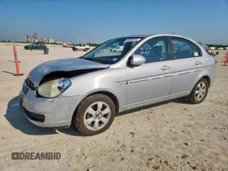 2006 Hyundai Accent GLS z VIN KMHCN46C76U050804, wystawiony jako Copart lot #80268015 z przebiegiem 144 099 mil mil oraz Szkoda całkowita • Salvage title. Historia ofert i sprzedaży dostępna na DreamBid. Obrazek 1.
