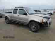 2004 Nissan Frontier XE with VIN 1N6ED29Y34C474296, listed as a Copart auction lot 87038494 with 195,260 mi miles and Salvage title. Bid and sale history available at DreamBid. Image 4.