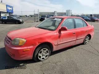 2005 Hyundai Accent GLS z VIN KMHCG45C25U639558, wystawiony jako Copart lot #71738525 z przebiegiem 239 682 mil mil oraz Szkoda całkowita • Salvage title. Historia ofert i sprzedaży dostępna na DreamBid. Obrazek 1.