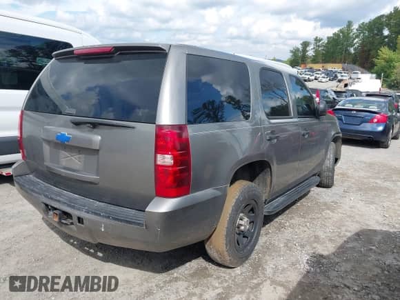 2007 Chevrolet Tahoe LS with VIN 1GNFC13C07R272851, listed as a IAAI auction lot 43310420 with 308,519 mi miles and . Bid and sale history available at DreamBid. Image 4.