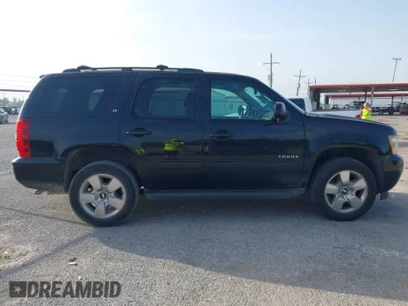 2014 Chevrolet Tahoe LT with VIN 1GNSCBE07ER120098, listed as a IAAI auction lot 42623461 with 166,170 mi miles and . Bid and sale history available at DreamBid. Image 13.