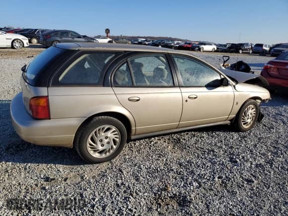 1999 Saturn SW with VIN 1G8ZK8277XZ162136, listed as a Copart auction lot 83206604 with Not provided miles and Salvage title. Bid and sale history available at DreamBid. Image 3.
