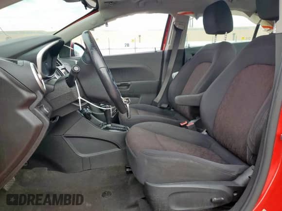 2018 Chevrolet Sonic LT with VIN 1G1JD5SB0J4104558, listed as a Copart auction lot 66185795 with 87,279 mi miles and Salvage title. Bid and sale history available at DreamBid. Image 7.