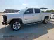 2017 Chevrolet Silverado 1500 LTZ with VIN 3GCPCSECXHG145834, listed as a Copart auction lot 65348985 with 153,460 mi miles and Salvage title. Bid and sale history available at DreamBid. Image 1.