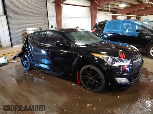 2012 Hyundai Veloster w/Gray Int z VIN KMHTC6AD3CU052773, wystawiony jako Copart lot #70096015 z przebiegiem 154 233 mil mil oraz Czysty tytuł • Clean title. Historia ofert i sprzedaży dostępna na DreamBid. Obrazek 4.