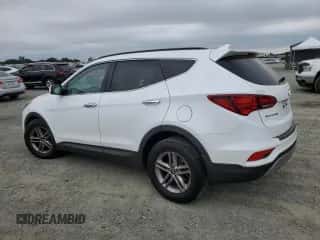 2017 Hyundai Santa Fe 2.4L z VIN 5NMZU3LB7HH050822, wystawiony jako Copart lot #81871005 z przebiegiem 101 559 mil mil oraz Szkoda całkowita • Salvage title. Historia ofert i sprzedaży dostępna na DreamBid. Obrazek 2.