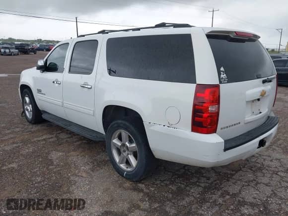 2013 Chevrolet Suburban LS with VIN 1GNSCHE05DR163615, listed as a IAAI auction lot 42633280 with 198,782 mi miles and . Bid and sale history available at DreamBid. Image 3.