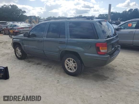 2004 Jeep Grand Cherokee Laredo with VIN 1J4GX48S24C314691, listed as a Copart auction lot 85491395 with 239,637 mi miles and Salvage title. Bid and sale history available at DreamBid. Image 2.