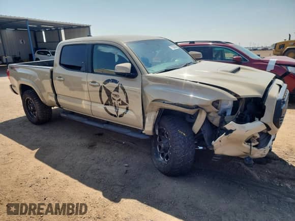 2016 Toyota Tacoma SR5 with VIN 5TFDZ5BN7GX011012, listed as a Copart auction lot 71530145 with 133,114 mi miles and Salvage title. Bid and sale history available at DreamBid. Image 4.