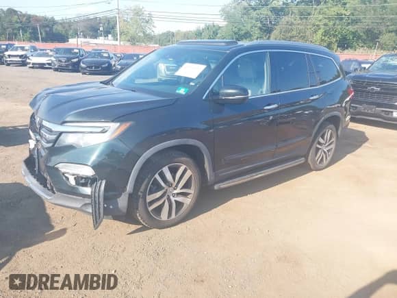 2016 Honda Pilot Touring with VIN 5FNYF6H9XGB120889, listed as a IAAI auction lot 43212929 with 129,095 mi miles and . Bid and sale history available at DreamBid. Image 18.