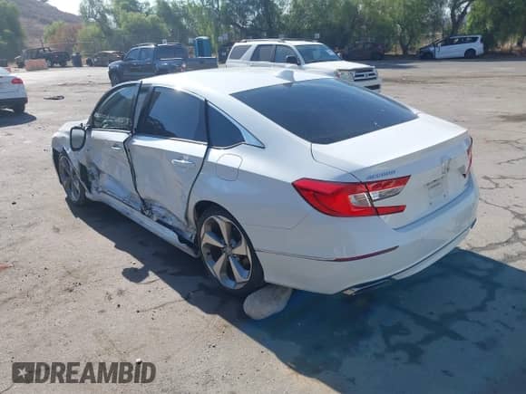 2018 Honda Accord Touring with VIN 1HGCV1F95JA146448, listed as a IAAI auction lot 43237331 with 28,446 mi miles and . Bid and sale history available at DreamBid. Image 3.
