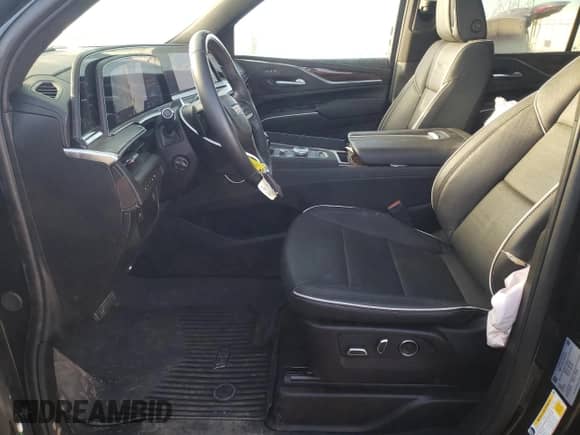 2024 Cadillac Escalade 4WD Premium Luxury with VIN 1GYS4BKL9RR232325, listed as a Copart auction lot 77145544 with 4,677 mi miles and Salvage title. Bid and sale history available at DreamBid. Image 7.