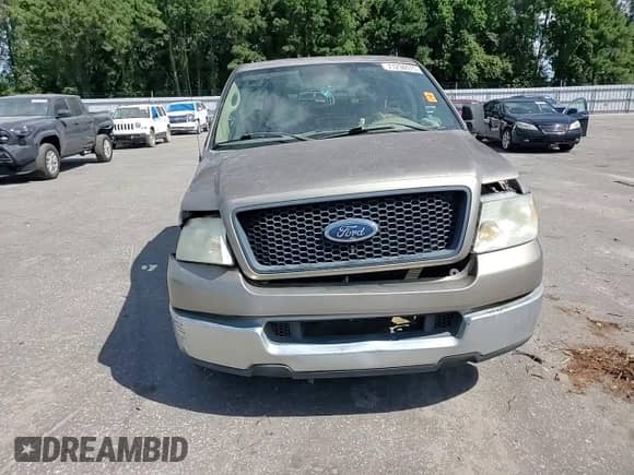 2005 Ford F-150 STX with VIN 1FTRX12W25FA37128, listed as a Copart auction lot 71256075 with 231,578 mi miles and Salvage title. Bid and sale history available at DreamBid. Image 13.