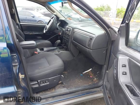 2002 Jeep Grand Cherokee Sport with VIN 1J4GW38S42C166263, listed as a IAAI auction lot 42521707 with 267,842 mi miles and . Bid and sale history available at DreamBid. Image 5.