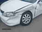 2002 Toyota Camry LE z VIN 4T1BE32K52U111483, wystawiony jako IAAI lot #43065186 z przebiegiem 64 862 mil mil oraz . Historia ofert i sprzedaży dostępna na DreamBid. Obrazek 6.